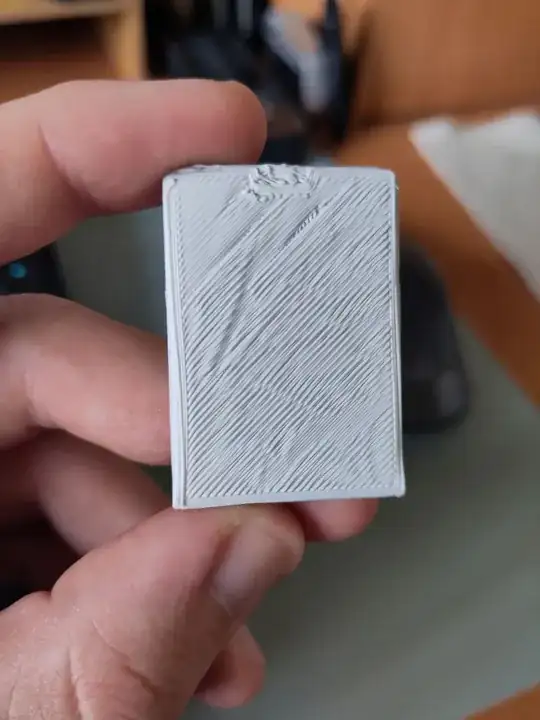 Photo of the first layer of a printed model showing printing errors